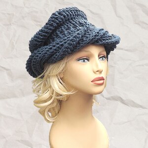 a mannequin head wearing a crocheted hat