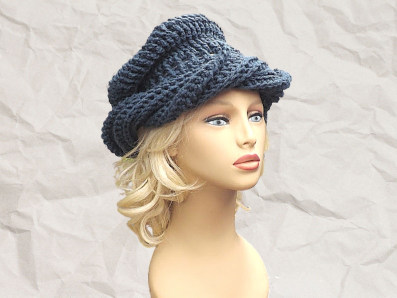 a mannequin head wearing a crocheted hat