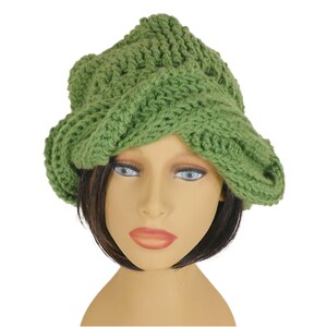 Unique Möbius Crochet Hat Pattern - Samantha Slouchy Beanie with Twist Brim. Front view of the same green knit slouchy beanie hat with twisted brim, as modeled on a mannequin head.