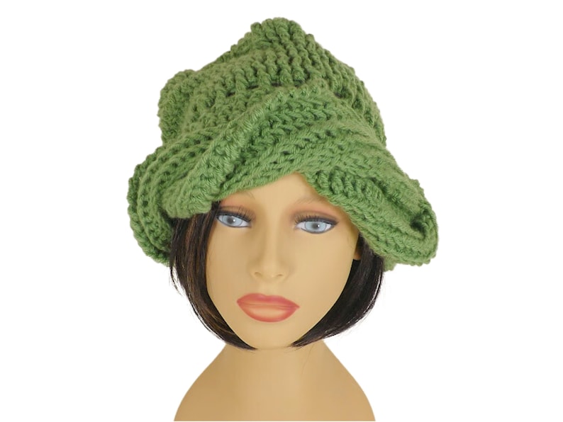 Unique Möbius Crochet Hat Pattern - Samantha Slouchy Beanie with Twist Brim. Front view of the same green knit slouchy beanie hat with twisted brim, as modeled on a mannequin head.