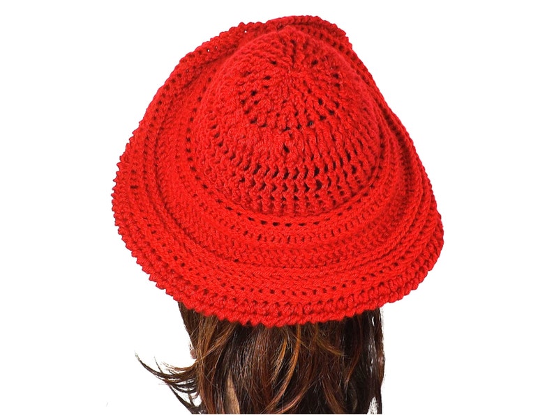 Back view of the red Mobius crochet hat, highlighting the detailed stitch patterns and the distinct Mobius twist at the back