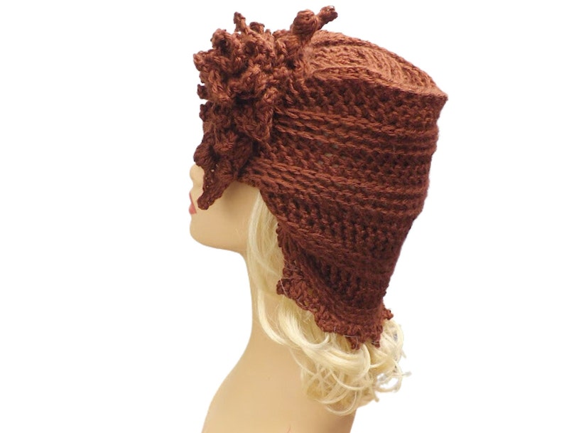a crocheted hat on a mannequin head