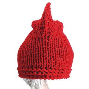 a red knitted hat on a mannequin head