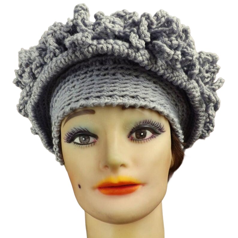 a close up of a mannequin head wearing a hat