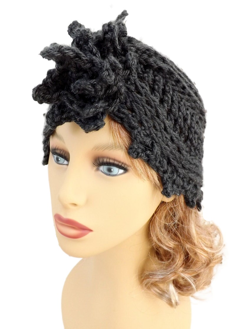 a mannequin head wearing a black knitted hat