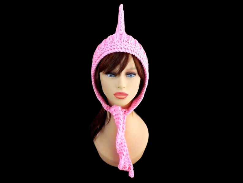 a pink knitted pixie hood hat on a mannequin head