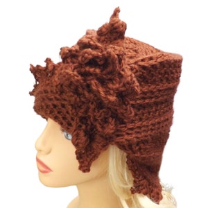 close up view of a crocheted hat on a mannequin head