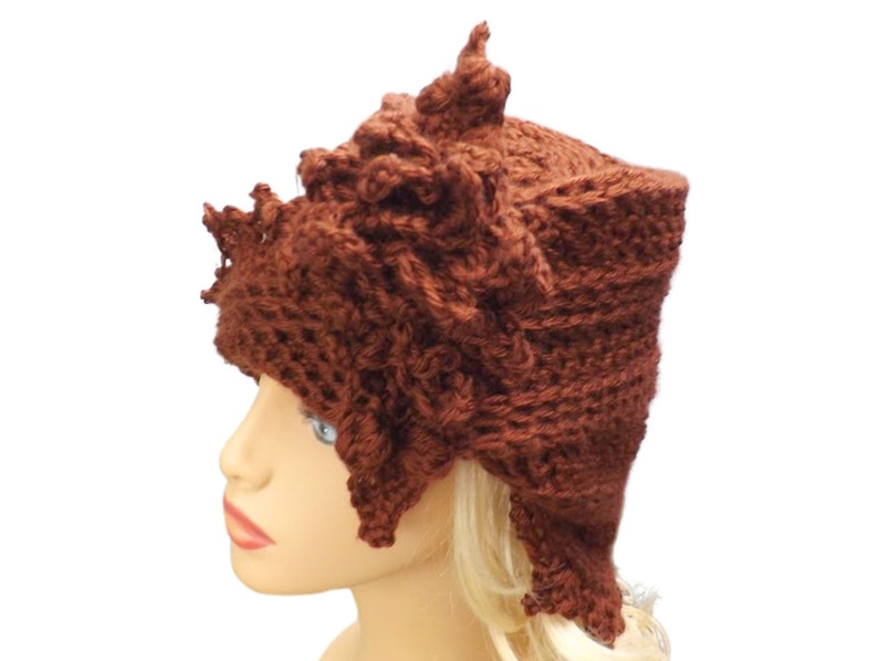 close up view of a crocheted hat on a mannequin head
