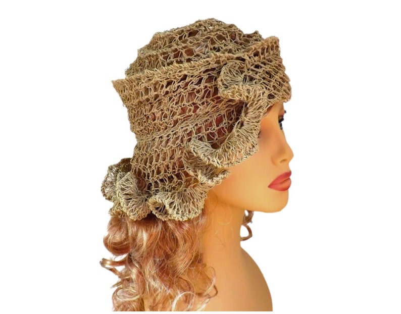 a mannequin head wearing a natural hemp twine hat with a diagonal ruffle