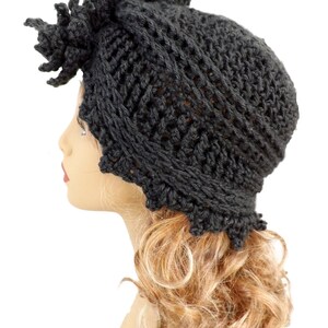 a mannequin head wearing a black knitted hat