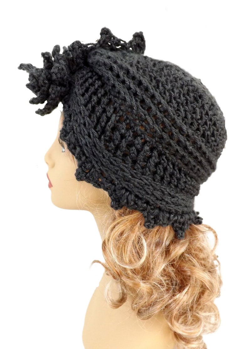 a mannequin head wearing a black knitted hat