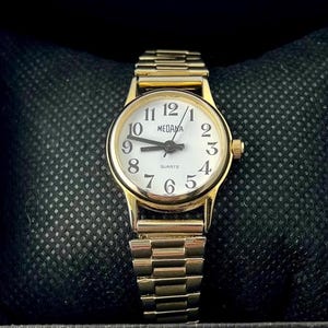 montre Medana vintage pour femme dorée