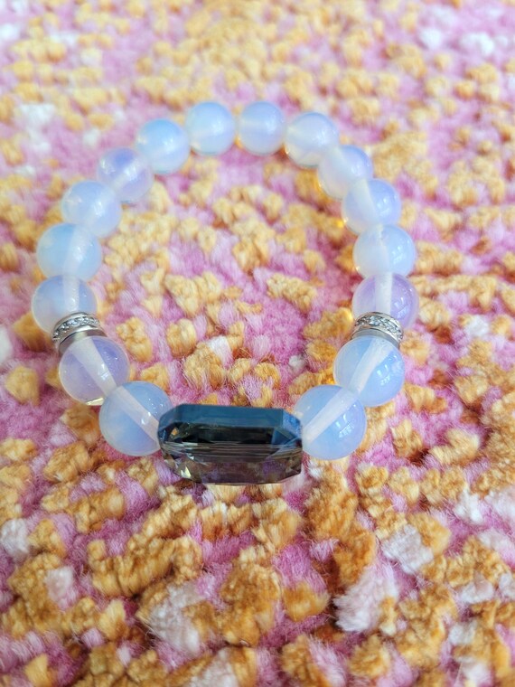 Energetically ELEVATING opal glass beads complimenting blue faceted crystal focal bead stretch stacking bracelet
