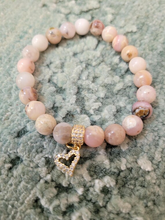 Energetically CALMING pale pink peruvian opal beads complimenting cz paved gold plated heart charm and bead stretch, stacking bracelet.