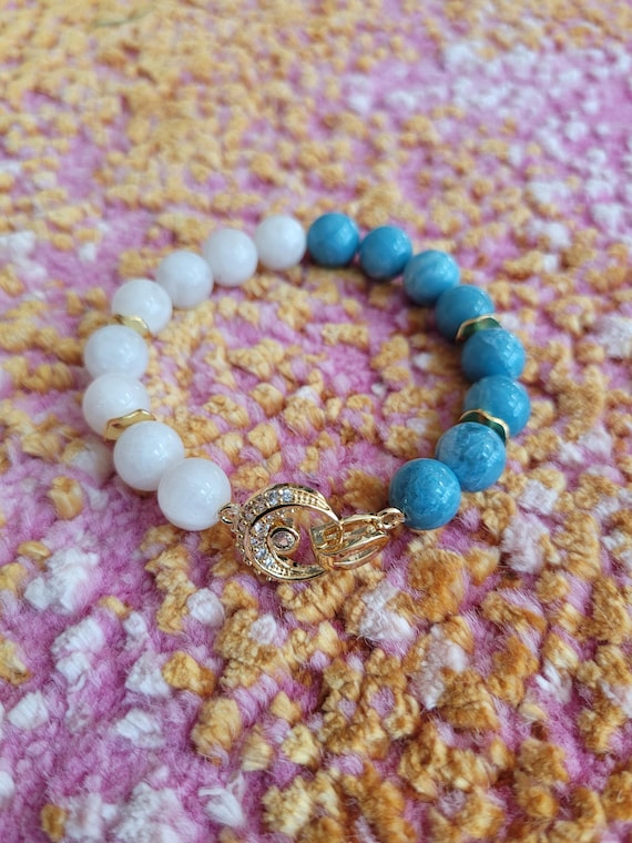 Energetically EMPOWERING larimar and snow quartz beads complimenting crescent moon shaped gold focalpiece stretch, stacking bracelet
