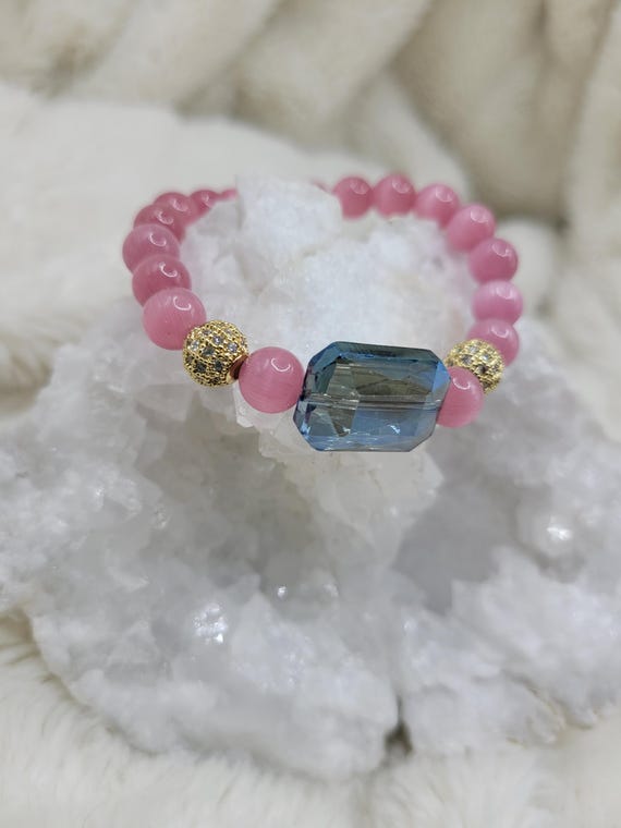 Energetically TRANSFORMING pink cat's eye beads with blue faceted crystal focal bead stretch stacking bracelet
