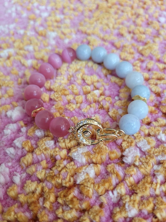 Energetically LOVING pink cats eye and chalcedony beads complimenting crescent moon shaped gold focalpiece stretch, stacking bracelet
