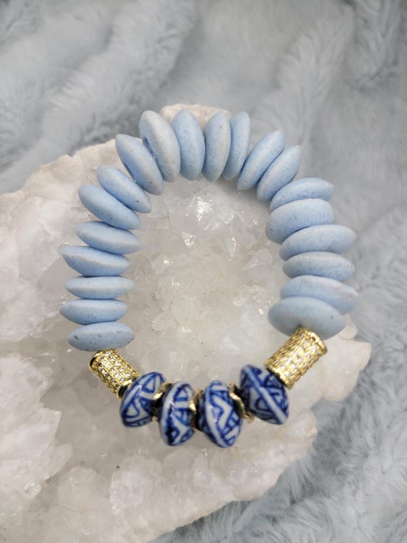 Energetically INSPIRING chinoserie boho saucer beads paired with light blue sandcast saucer beads stretch, stacking bracelet.