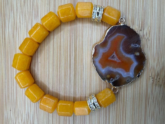 Energetically ELEVATING yellow Jade box cut cube gemstone beads paired with gold plated agate slice focalpiece stretch stacking bracelet