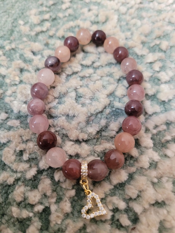 Energetically ELEVATING purple berry quartz beads complimenting cz paved gold plated heart charm and bead stretch, stacking bracelet.