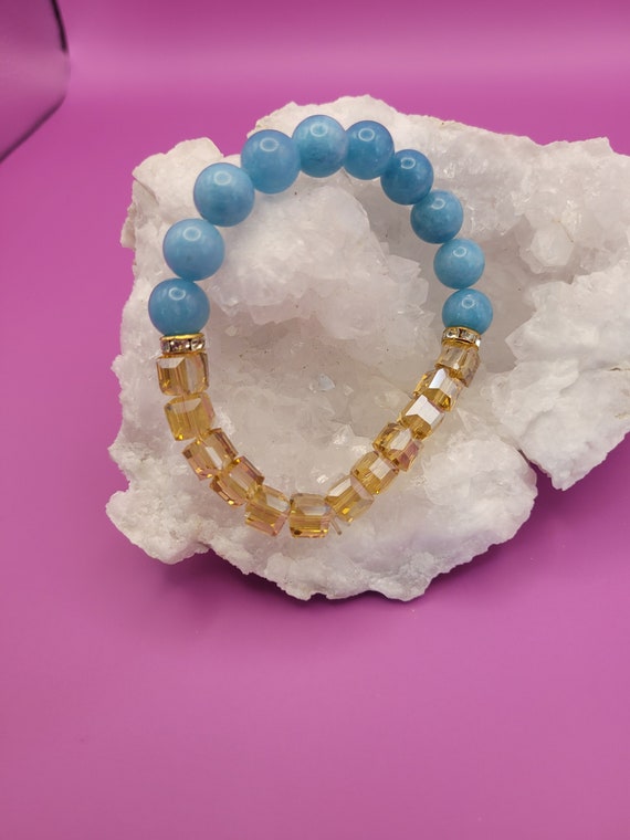 Energy CALMING Blue Chalcedony gemstone beads accented with champagne colored glass cube beads.