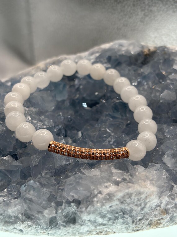 Energetically PROTECTING selenite beads with cubic zirconia pave rose gold plated noodle focal bead stretch bracelet