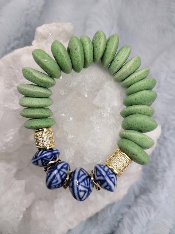 Energetically INSPIRING chinoserie boho saucer beads paired with green sandcast saucer beads stretch, stacking bracelet.
