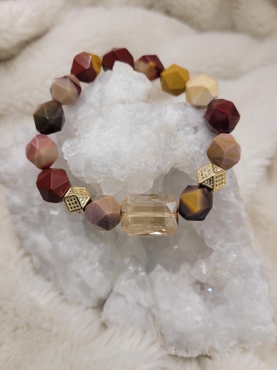 Energetically REGENERATING diamond cut mookaite beads gracing champagne crystal focal bead.