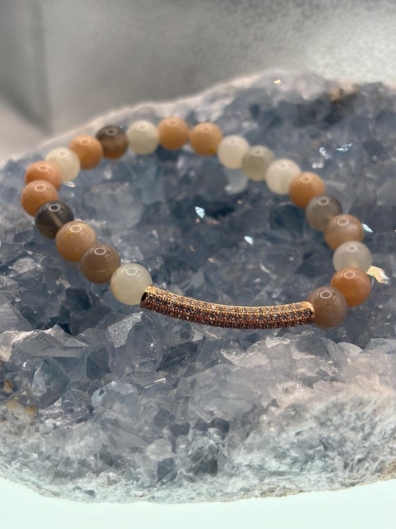 Energetically CALMING peach moonstone beads with cubic zirconia pave rose gold plated noodle focal bead stretch bracelet