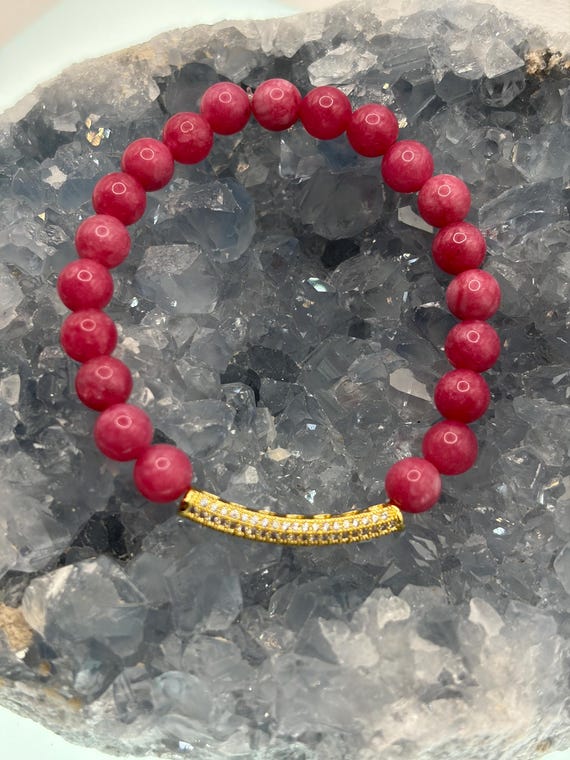 Energetically INSPIRING bright pink jade beads with cz paved gold plated noodle focal bead stretch bracelet