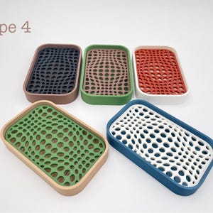May include: Rectangular soap dishes in various colors, including navy, brown, green, red, and blue. Each dish features a unique, textured pattern with a perforated design. The text "Type 4" is in the upper left corner.