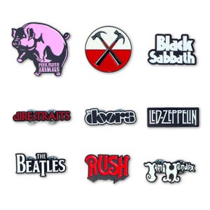 May include: A collection of nine enamel pins featuring classic rock band logos and imagery, including Pink Floyd Animals, The Wall hammers, Black Sabbath, Dire Straits, The Doors, Led Zeppelin, The Beatles, Rush, and Jimi Hendrix in various colours.