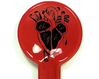 A Spoon Rest with an Anatomical Heart print on Berry Red glaze. Pick Your Color/Pick Your Print