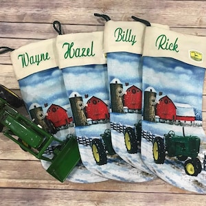 May include: Four personalized Christmas stockings with a winter farm scene featuring a red barn, silo, and a green tractor. The stockings are decorated with white faux fur and have the names "Wayne", "Hazel", "Billy", and "Rick" embroidered on them.