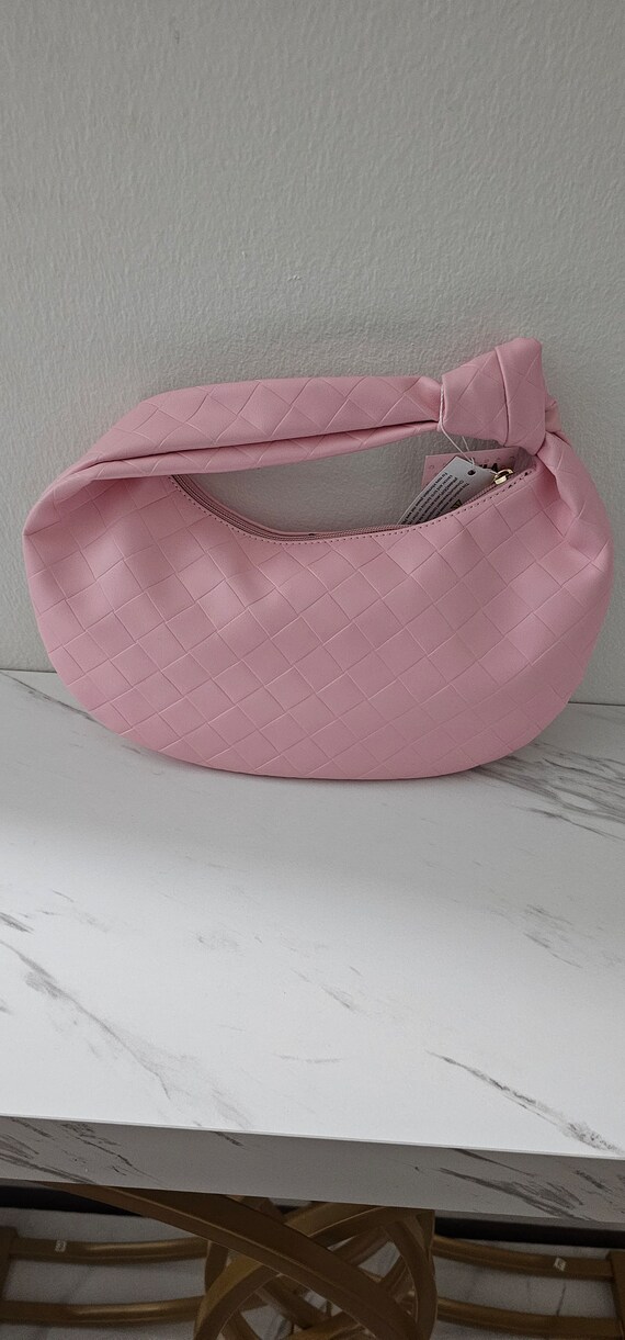 this baby pink leather handbag for ladies.