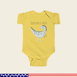 May include: Yellow baby onesie with a cartoon dinosaur and the text "Taxation is Theft".