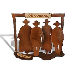 May include: Metal silhouette of four cowboys standing in front of a sign that reads "OK Corral" and "Tombstone, AZ".