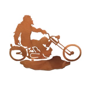 May include: A copper-colored metal silhouette of a person riding a motorcycle. The person is wearing a jacket and has long hair. The motorcycle has a large front wheel and a smaller back wheel.