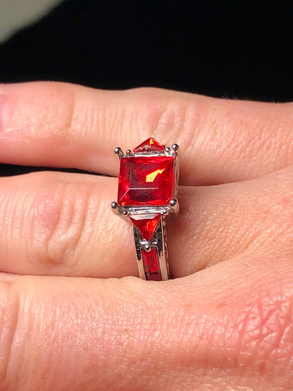 Silvertone ring with ruby red stones - image 1