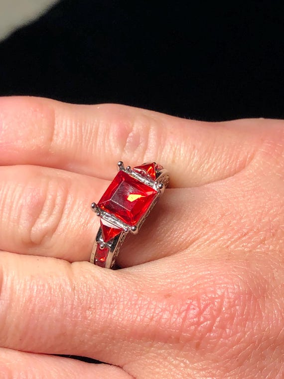 Silvertone ring with ruby red stones - image 4