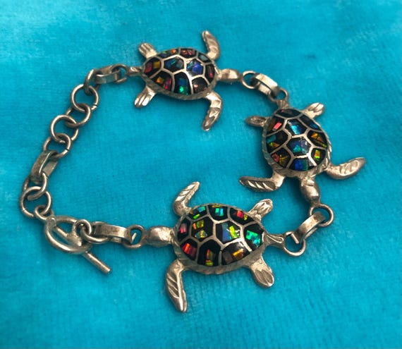 Silver multi turtle braclet featuring iridescent … - image 1