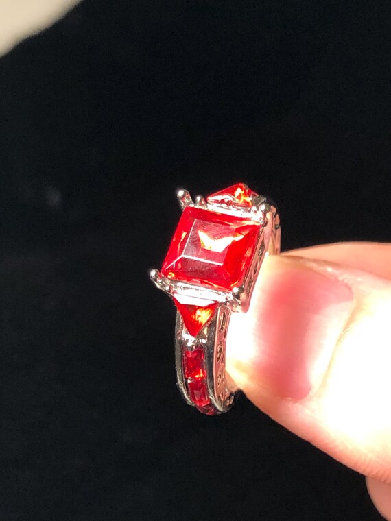 Silvertone ring with ruby red stones - image 3