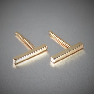 Handmade solid 14K yellow gold bar earrings. Made from square wire these bar earrings are 11mm long and 1.5mm by 1.5mm wide, looks like a long skinny rectangle. Also comes in Rose and White gold.