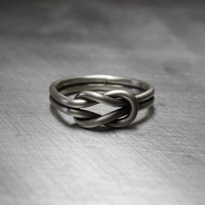 Matte finish on sterling silver sailor knot ring. Celtic design.