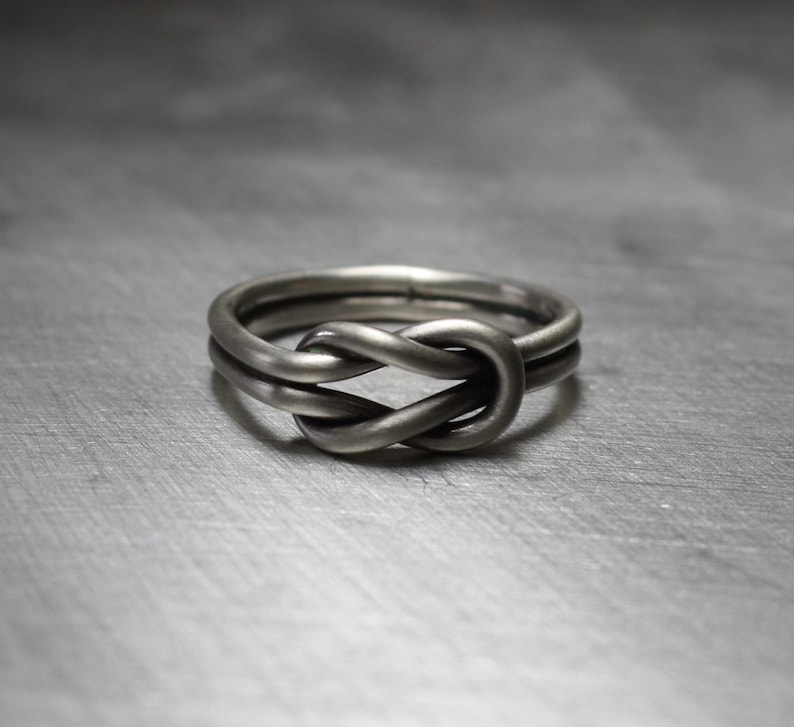 Matte finish on sterling silver sailor knot ring. Celtic design.