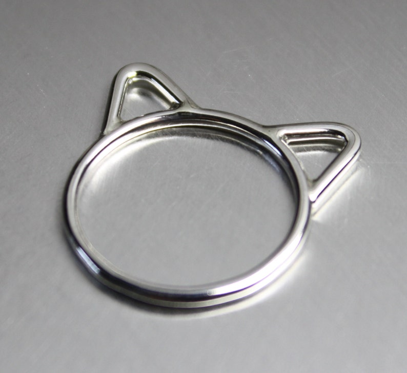 Handmade sterling silver cat ears ring. Wire design featuring a cat head silhouette with pointy ears.