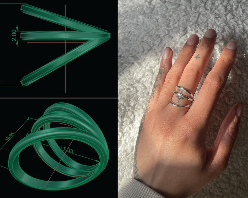 Puede incluir: Un anillo de plata con tres bandas que se envuelven alrededor del dedo. El anillo se muestra en una mano con un peque&ntilde;o tatuaje.