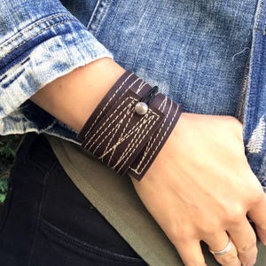 Brown  leather bracelet wrap cuff for men or women with white stitching unique comfortable adjustable size with elastic closure