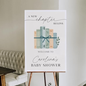 Letrero de bienvenida para baby shower &quot;Un nuevo capítulo comienza&quot; con temática de libro azul y verde. Letrero editable para baby shower de niño. Descarga instantánea.
