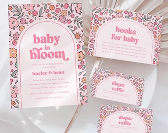 May include: Pink floral baby shower invitations and inserts. The invitation reads "Baby in Bloom" with event details. Additional cards include "Books for Baby" and "Diaper Raffle" with matching floral designs.